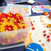 Using plastic bricks to demonstrate up and down quarks